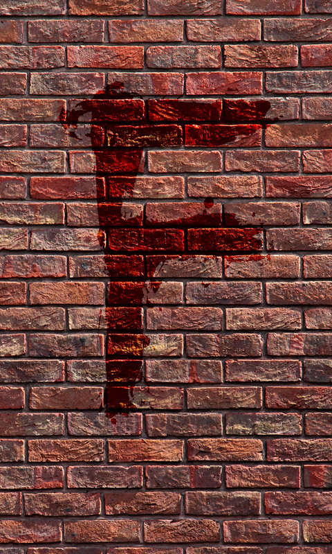 Blutiges F an einer Backsteinmauer