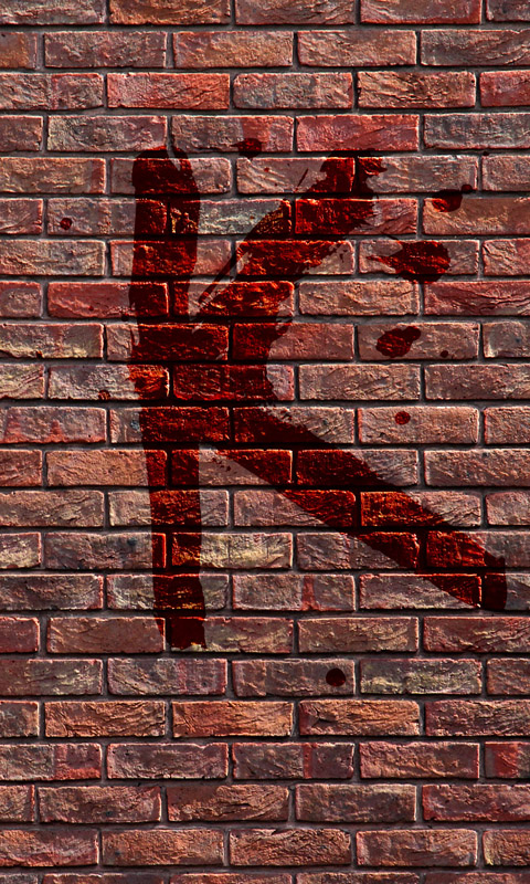 Blutiges K an einer Backsteinmauer