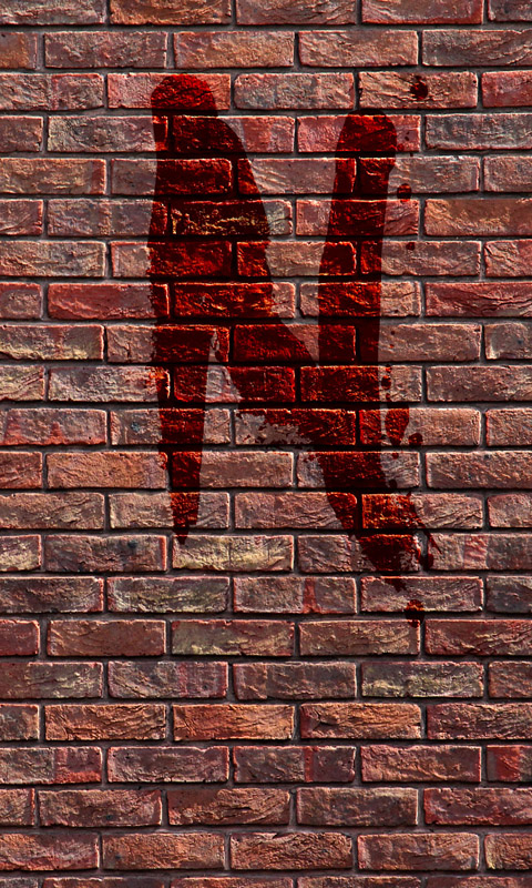 Blutiges N an einer Backsteinmauer