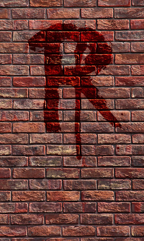 Blutiges R an einer Backsteinmauer